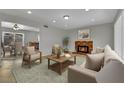 Comfortable living room with a brick fireplace and access to the dining area at 317 Kane Ave, Las Vegas, NV 89110
