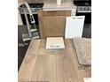 Interior design scheme showcasing sleek stainless faucet and luxury vinyl plank flooring at 3723 Via Allegro, Henderson, NV 89044