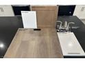 Interior finishes displaying paint and wood tones against dark marble countertop at 3723 Via Allegro, Henderson, NV 89044