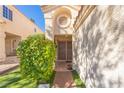 Inviting front entrance with decorative architectural details and manicured landscaping, enhancing curb appeal at 433 Jubilation Dr, Las Vegas, NV 89145