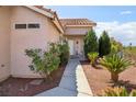 Charming home exterior featuring well-maintained landscaping and a welcoming entrance at 4753 Carefree Dr, Las Vegas, NV 89122