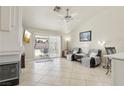 Spacious living area with tile flooring, neutral paint, and sliding glass doors to the outdoor patio space at 4753 Carefree Dr, Las Vegas, NV 89122