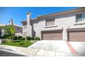 Charming two-story home with a well-maintained lawn, two-car garage, and mature landscaping at 507 Satin Saddle Pl, Henderson, NV 89052