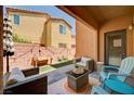 Cozy covered patio with comfortable seating area, perfect for outdoor relaxation and entertaining at 7704 Lots Hills Dr, Las Vegas, NV 89179