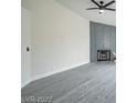 Bright living room features wood floors and a fireplace with decorative paneling at 849 Brahma Ln, Henderson, NV 89002