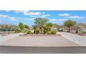 Charming single story home featuring a spacious driveway and gorgeous desert landscaping at 8808 Homestead Rd, Las Vegas, NV 89143