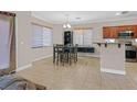 Bright dining area next to the kitchen featuring a modern table and chairs at 10601 Lessona St, Las Vegas, NV 89141
