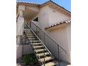 Exterior view of a residential building with a staircase leading to the upper units at 1320 Driscoll Dr # 201, Las Vegas, NV 89128