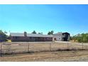 Ranch-style home with brick exterior, large lot and separate outbuilding, plus mature landscaping at 1400 Silver Peak Ave, Pahrump, NV 89048