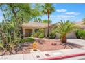 Charming single-story home featuring desert landscaping, shrubs and a two-car garage at 1789 Castro Hill Ave, Henderson, NV 89012