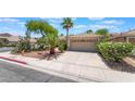 Charming single-story home featuring a well-maintained yard, desert landscaping and two-car garage at 1789 Castro Hill Ave, Henderson, NV 89012