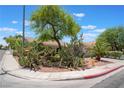 Charming single-story home featuring desert landscaping, shrubs and a two-car garage at 1789 Castro Hill Ave, Henderson, NV 89012