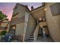 Exterior shot at dusk featuring stairs leading to units with terracotta-colored roofs at 2200 S Fort Apache Rd # 2041, Las Vegas, NV 89117