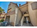 Exterior angle features stairs leading to units with terracotta-colored roofs at 2200 S Fort Apache Rd # 2041, Las Vegas, NV 89117