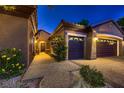Home exterior showcasing a three-car garage with a textured driveway and walkway at 2786 Scotts Valley Dr, Henderson, NV 89052