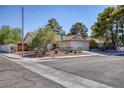 Well-maintained single story home with a two-car garage and mature landscaping at 3129 White Rose Way, Henderson, NV 89014