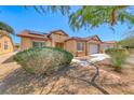 Inviting single-story home featuring a low maintenance desert landscape, and solar panels at 3604 Cantura Crest Ct, North Las Vegas, NV 89031