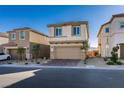 Charming two-story home boasts a well-maintained yard, two-car garage and welcoming facade at 3921 Painted Lady Ave, Las Vegas, NV 89141