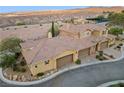 An aerial view showcasing the home's location and multi-car garage at 4 Via Centrale # 1, Henderson, NV 89011
