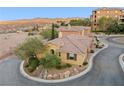 An exterior view of the home showing its architecture and desert landscaping at 4 Via Centrale # 1, Henderson, NV 89011