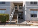 Exterior shot of building entrance with stairs leading to the second floor at 6800 E Lake Mead Blvd # 2076, Las Vegas, NV 89156