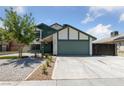Inviting home exterior with a two-car garage, low maintenance yard and spacious driveway at 6999 Montcliff Ave, Las Vegas, NV 89147