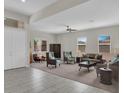 Inviting living room with plush seating, large windows, and neutral color palette at 7230 Fresh Harvest Ave, Las Vegas, NV 89131