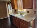 Cozy kitchen showcasing wooden cabinets and ample counter space at 745 Greenbriar Townhouse Way, Las Vegas, NV 89121