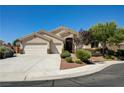 Inviting single-story home with a well-maintained yard and a convenient three-car garage at 8204 Turbys Treehouse Pl, Las Vegas, NV 89131