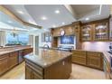 Gourmet kitchen featuring custom cabinetry, granite countertops, and stainless steel appliances at 9101 Alta Dr # 301, Las Vegas, NV 89145
