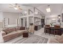 Open-concept living room boasts high ceilings and lots of natural light, creating an inviting atmosphere at 1761 Summerwood Cir, Henderson, NV 89012