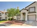 Charming two-story home featuring a well-manicured yard, a front-facing garage, and neutral paint at 198 Winterport St, Henderson, NV 89074