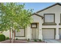 Charming two-story home featuring a well-manicured yard, a front-facing garage, and neutral paint at 198 Winterport St, Henderson, NV 89074