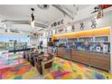 Modern kitchen with stainless steel appliances, custom cabinets, and colorful epoxy flooring at 200 Hoover Ave # 1813, Las Vegas, NV 89101