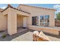 Inviting front entrance featuring a covered porch and desert landscaping with decorative rocks at 2717 Pastel Ave, Henderson, NV 89074