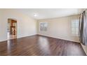Spacious living room featuring beautiful floors, neutral-toned walls, and plentiful natural light at 2717 Pastel Ave, Henderson, NV 89074