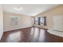 Bright and airy living room boasts hardwood floors and an abundance of natural light at 2717 Pastel Ave, Henderson, NV 89074