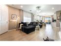 Bright living room featuring modern furniture, stylish decor, and sleek hardwood floors for comfortable living at 2845 Mincio St, Henderson, NV 89044