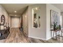 Inviting foyer with wood-look floors, decorative niche, console table, and stylish accents at 365 Sapphire Rock Ave, Las Vegas, NV 89183