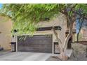 Two-story home with a two-car garage and desert landscaping at 4727 Sweeping Glen St, Las Vegas, NV 89129