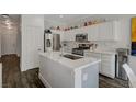 Bright kitchen featuring an island and stainless steel appliances at 4727 Sweeping Glen St, Las Vegas, NV 89129
