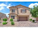 Beautiful two-story home with a well-maintained lawn and a spacious two-car garage at 4833 Royal Magnolia St, North Las Vegas, NV 89031