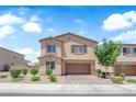 Charming two-story home boasts manicured landscaping and a two-car garage at 4833 Royal Magnolia St, North Las Vegas, NV 89031