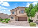 Attractive home showcasing meticulous landscaping and a convenient two-car garage at 4833 Royal Magnolia St, North Las Vegas, NV 89031