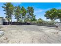 Fenced side yard of the property features a graveled area at 5008 Donnie Ave, Las Vegas, NV 89130