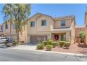 Charming two-story home featuring a well-maintained yard and attached two-car garage, perfect for Gathering living at 5484 Mercury Springs Dr, Las Vegas, NV 89122