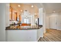 Kitchen view showcasing granite counters, breakfast bar, stainless appliances, and an open design at 5967 Sun Appello Ave, Las Vegas, NV 89122
