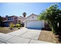 Charming single story home with a two car garage and desert landscaping at 6131 Pumpkin Patch Ave, Las Vegas, NV 89142