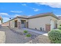 A single story home featuring a low maintenance desert rock yard at 6141 Tokara Ave, Las Vegas, NV 89122
