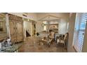 Elegant foyer featuring detailed woodwork, tile flooring, and stylish seating at 6275 Allspice Ct, Las Vegas, NV 89142
